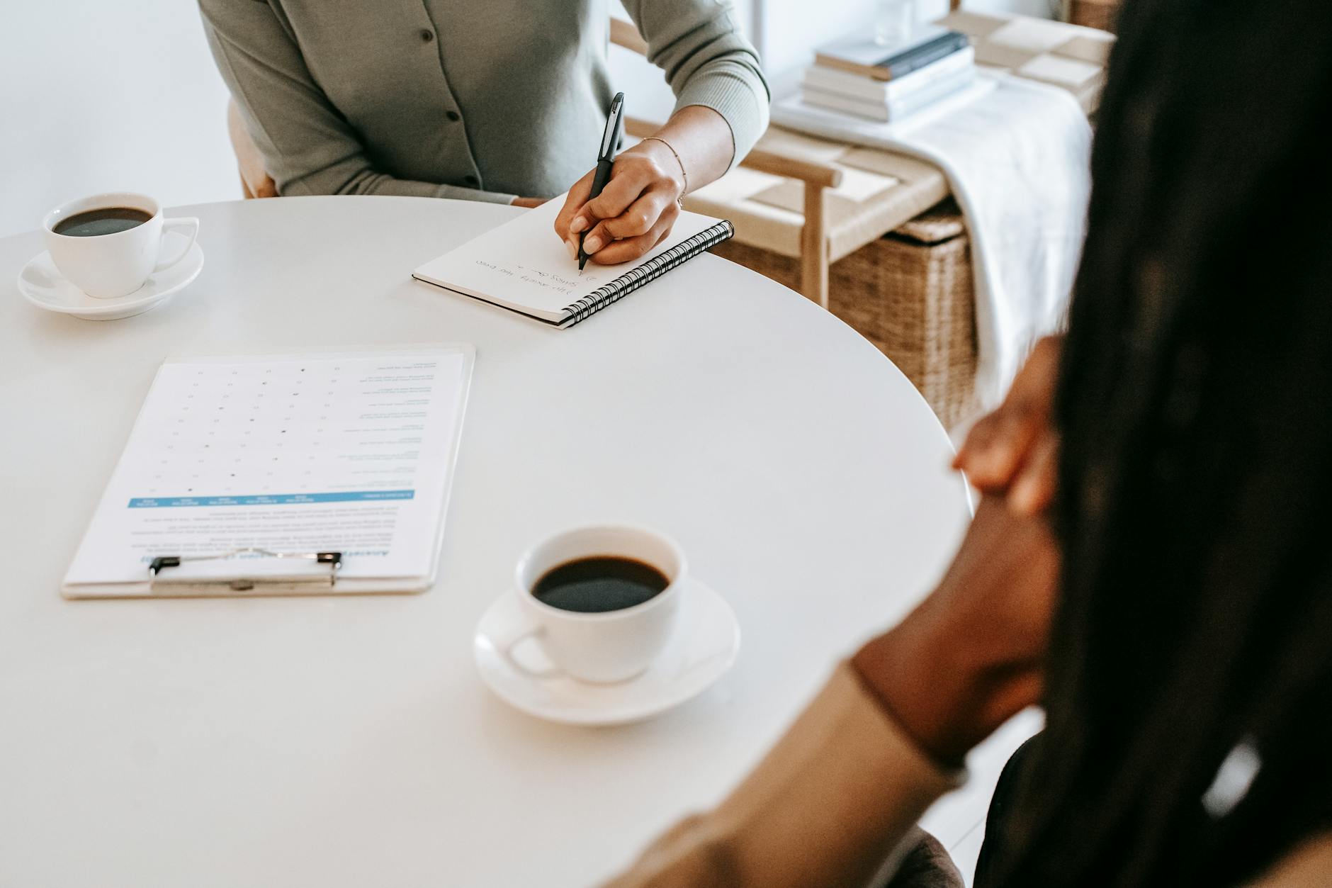 Interviewer taking notes during a job interview