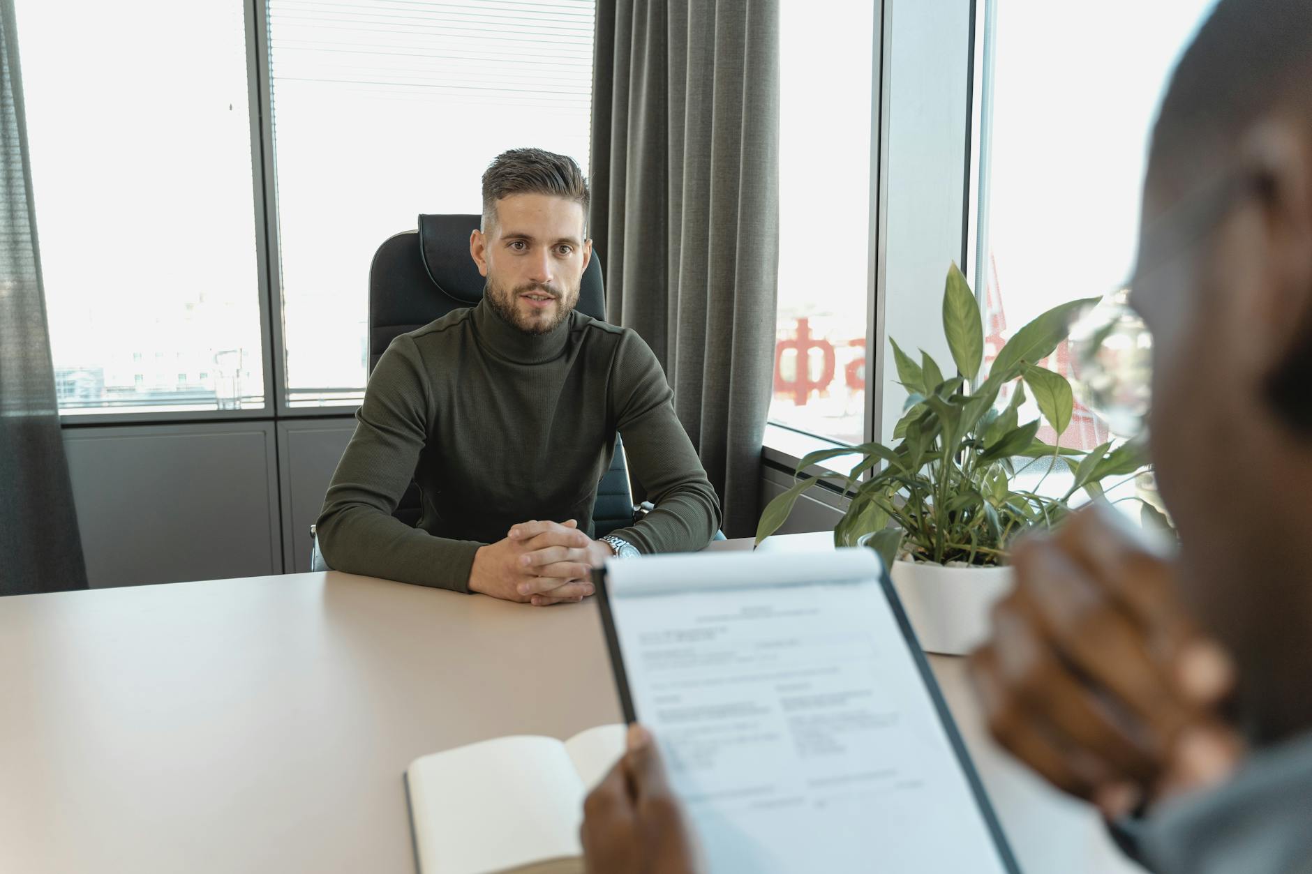 Professional interview conversation in a modern office